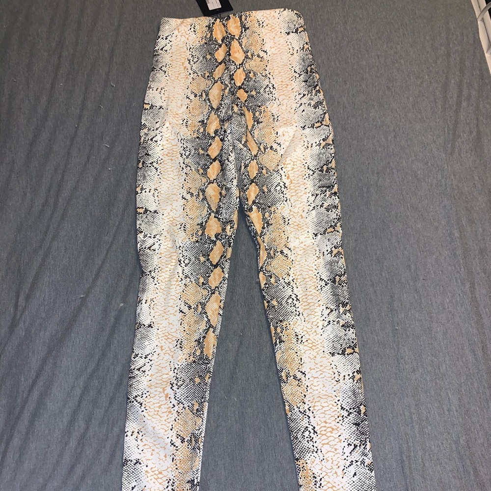 White snakeskin faux leather pants